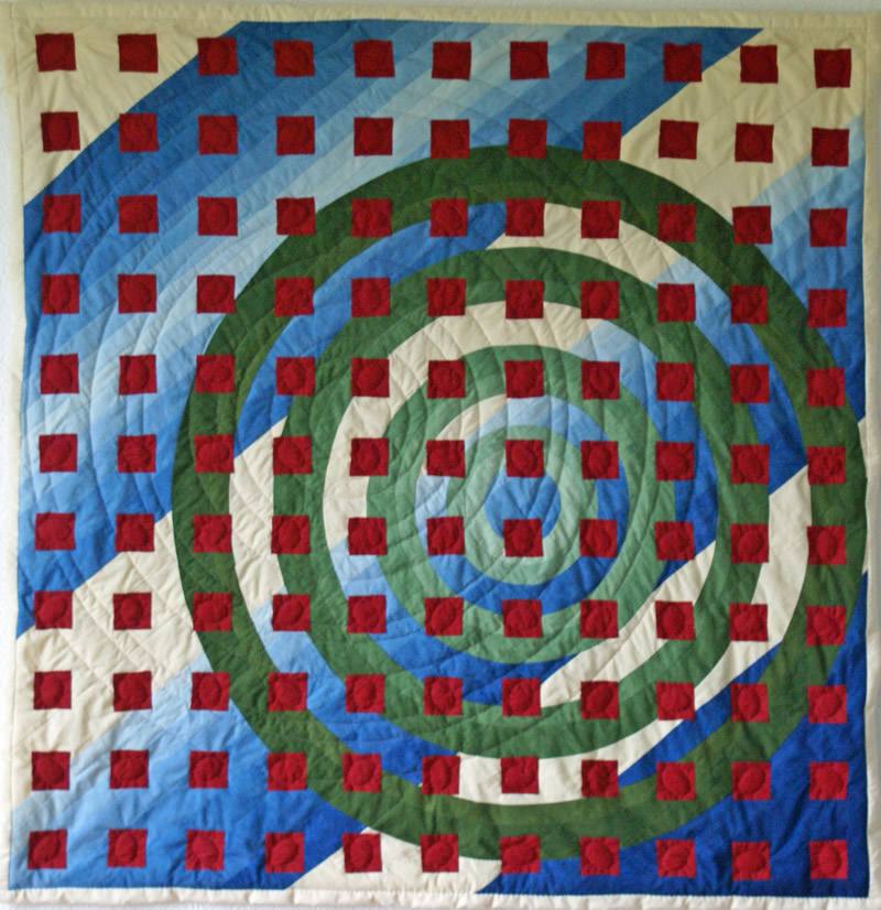 Quilt Rote Quadrate auf grünen Kreisen